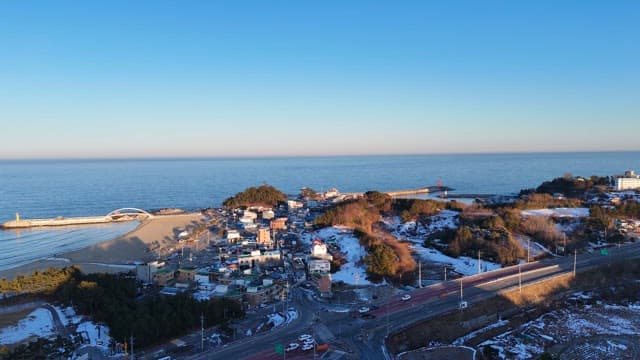 Coastal town with snowy landscape