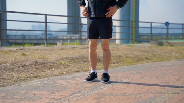 Man preparing to run on a sunny day