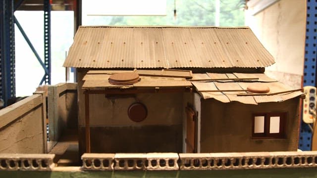 Elaborate miniature of an old house made of cement