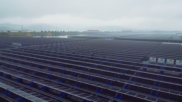 Floating solar panels on a misty river