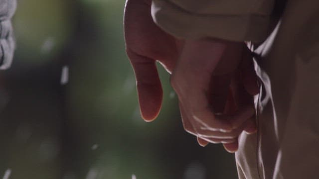 Hands gently holding each other