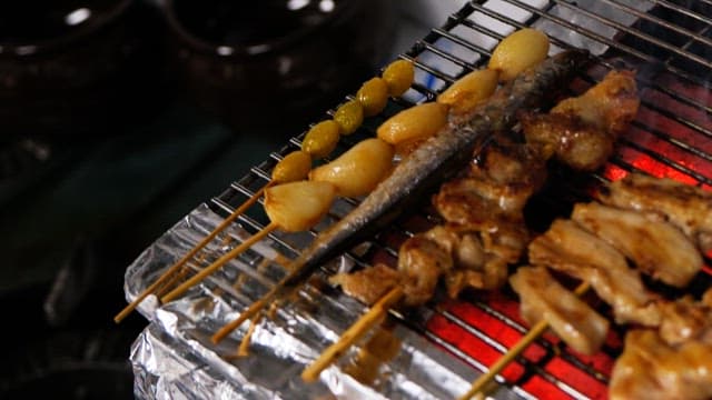 Grilled skewers sizzling deliciously on a red-hot grill