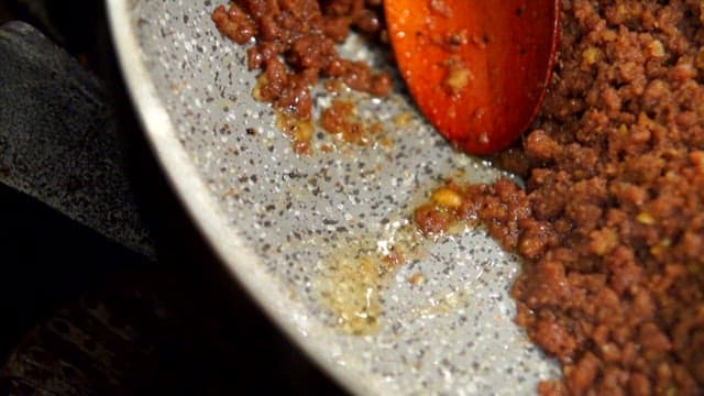 Ground meat cooking in a pan
