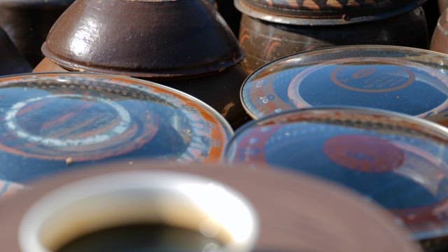 Traditional Pots, Earthenwares and Small Dishes for Soy Sauce on a Sunny Day