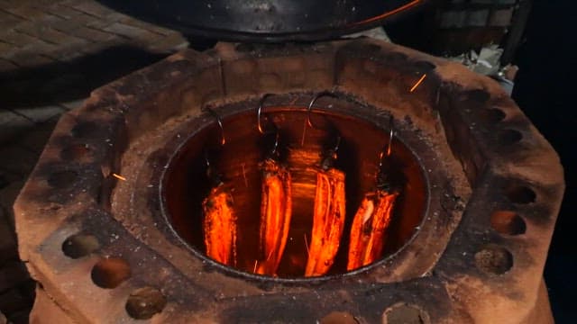 Eel being grilled in a jar