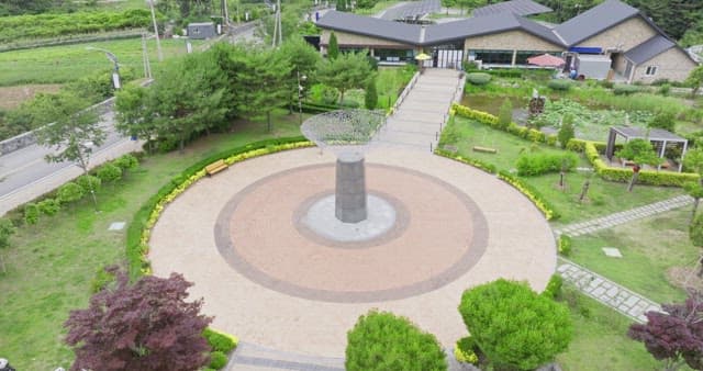Circular plaza surrounded by greenery
