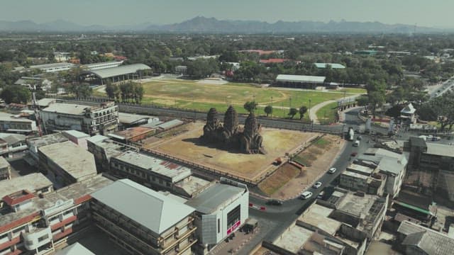 Overview of a Bustling Street with Ancient Temple Ruins