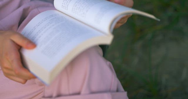 Person who Drops the Book She was Reading