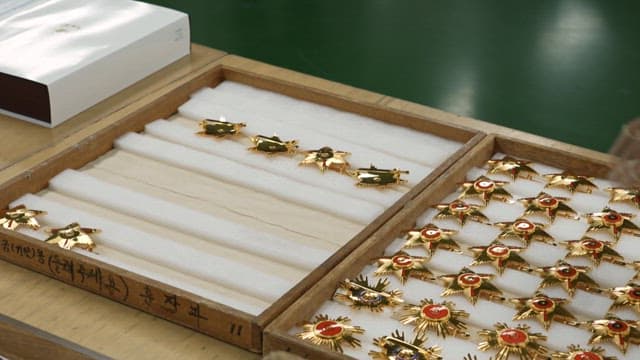 Process of making a metal medal