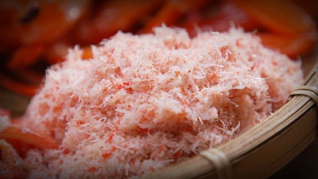 Close-up shots of shredded crab meat and slices