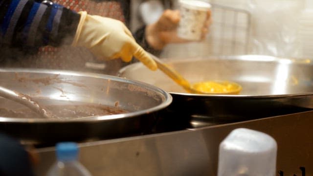 Pumpkin porridge served in paper cups on the street