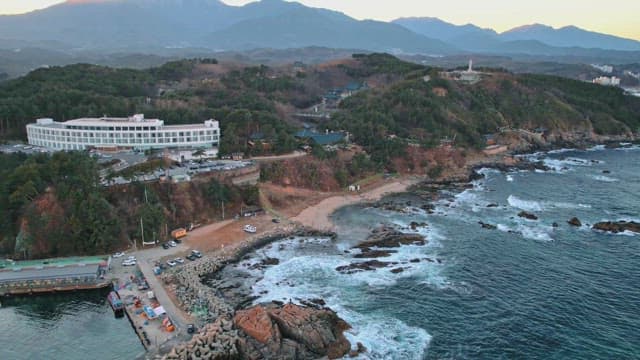 Coastal landscape with mountains and traditional korean houses