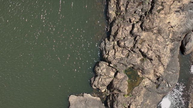 Aerial View of a Rocky Landscape with Waterfall