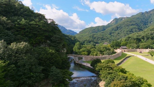 Historic stone castle with mountains in the background