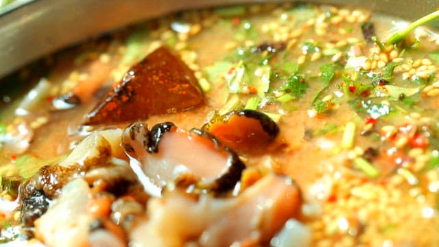 Close-up of fresh top shell cold raw fish soup