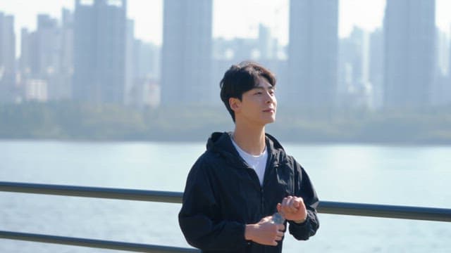 Man drinking water while walking