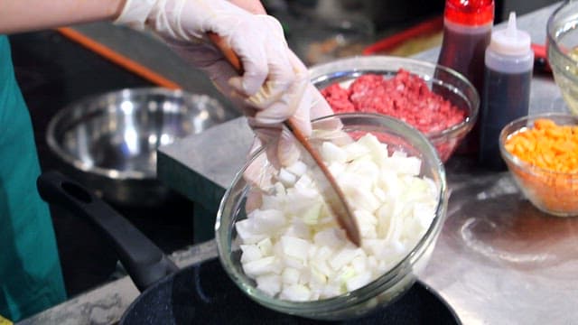 Chopped onions and carrots in a pan