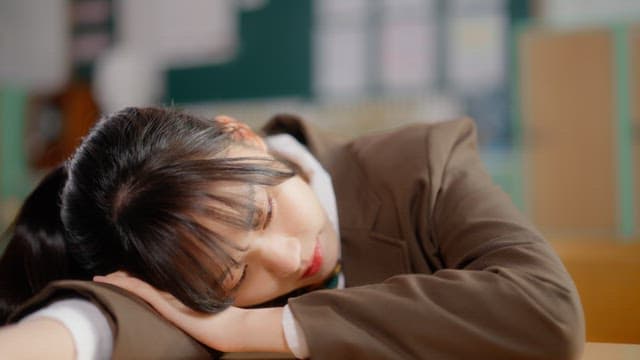Student sleeping in a classroom