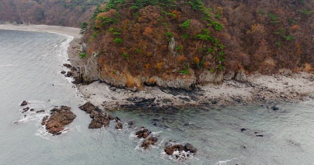Secluded Coastal Line with Clear Sea Water