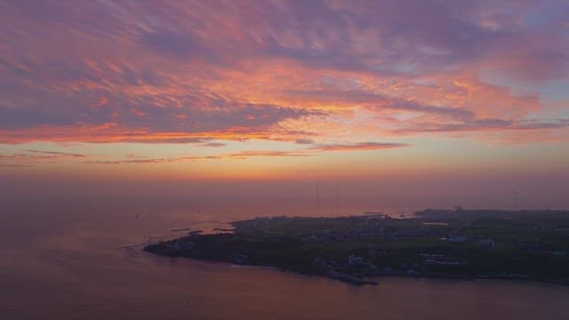 Serene coastal landscape at sunset