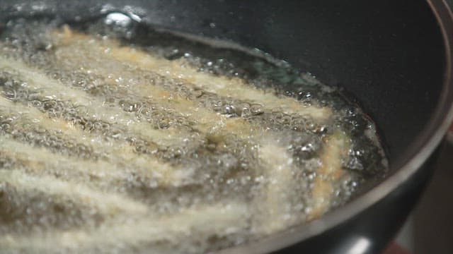 Frying Breadcrumbed Asparagus in Oil