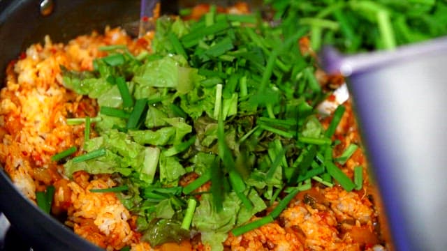 Chives added to spicy fried rice