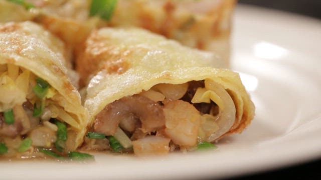 Appetizing spring rolls with chives and meat