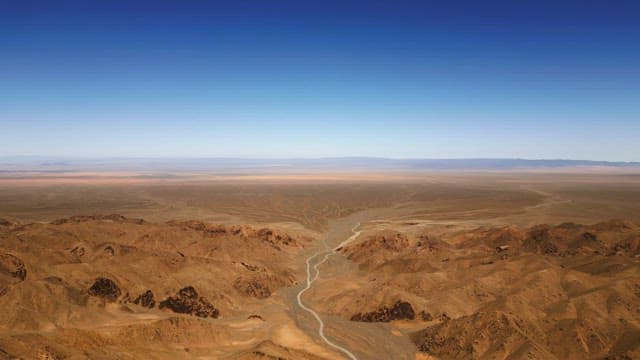 Vast desert landscape under blue sky