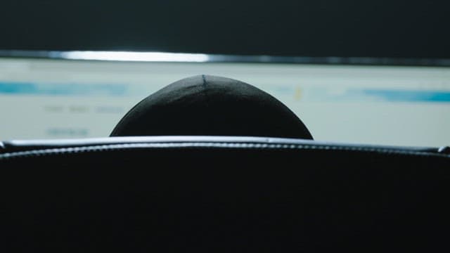 Man browsing a bulletin board on website with his computer