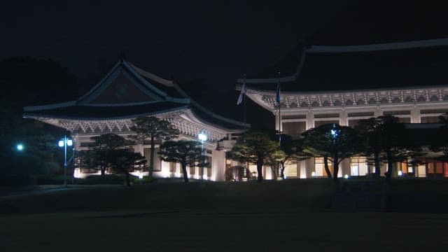 Illuminated Blue House at night