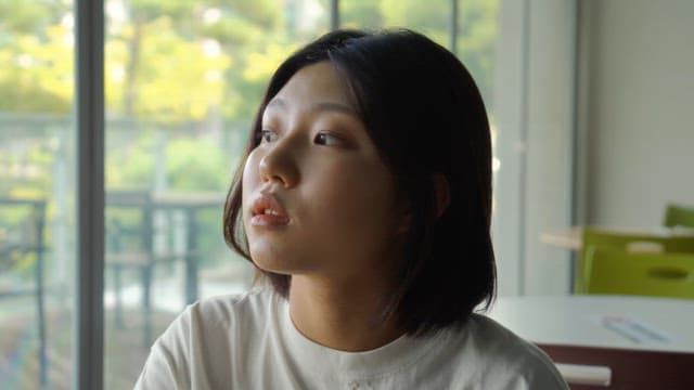 Woman relaxing with a drink at a cafe