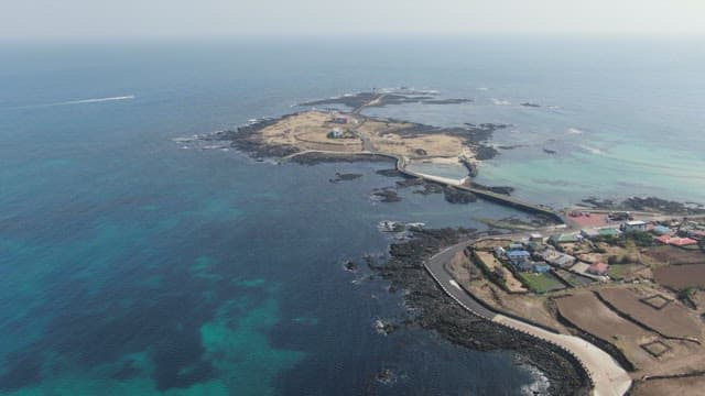 Small island surrounded by blue sea