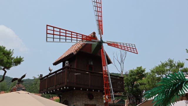 Traditional windmills turning at tourist destinations on a clear day