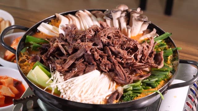 Simmering Hot Pot with Mushrooms and Shredded Meat