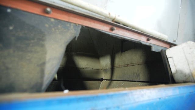 Gradual accumulation of garbage in an industrial waste container