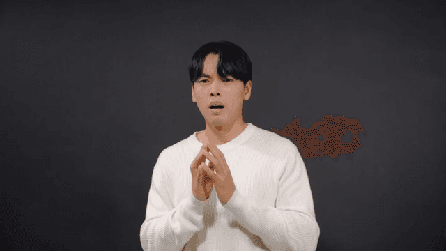 Man covering his mouth in surprise and expressing anxiety