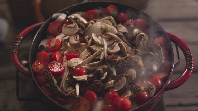 Steaming Pot with Assorted Mushrooms and Tomatoes