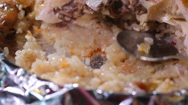 Nurungji made by pressing glutinous rice with a spoon on foil