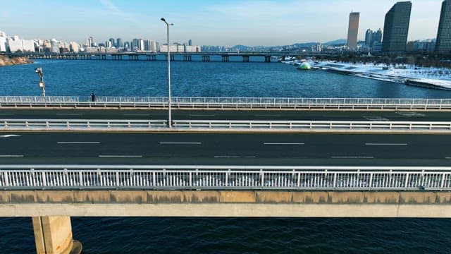 Cityscape with bridge over river and traffic