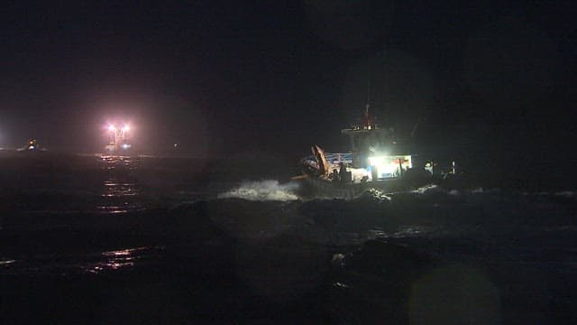Fishing Boat Setting Sail in Preparation for Night Fishing
