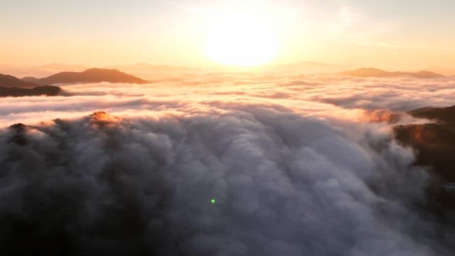 Sunset over clouds and mountains