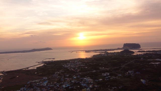Sunset over a coastal village and sea