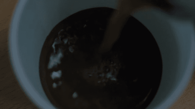 Coffee poured into a white paper cup