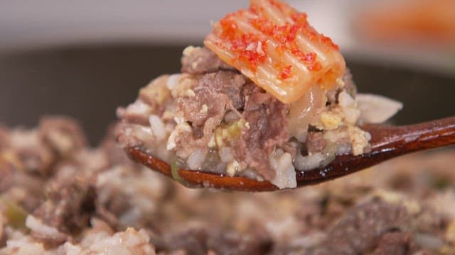 Spoonful of Korean beef and rice with kimchi