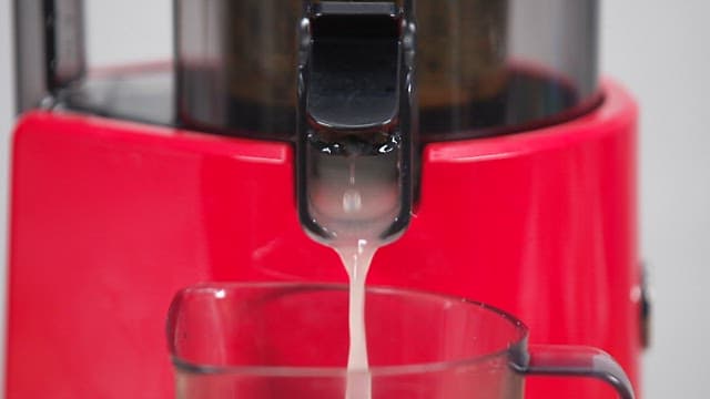 Korean Melon Juice Being Extracted from Juicer