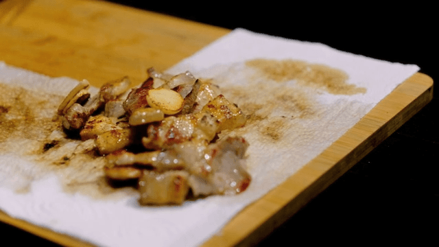 Grilled pork belly on a cutting board