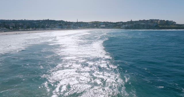 Coastal Town Overlooking Shimmering Ocean