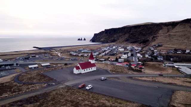 Coastal village with a red-roofed church