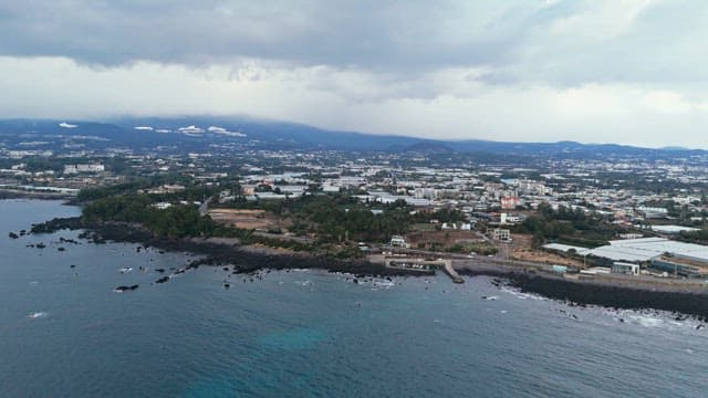 Coastal city with cloudy skies