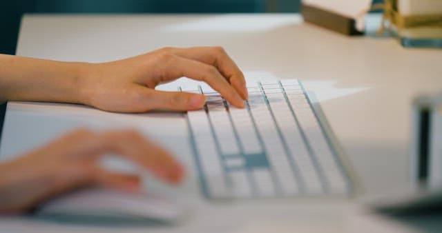 Working on a Computer with a Wireless Keyboard and Mouse